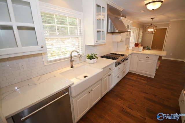 kitchen with white cabinetry, sink, decorative backsplash, hanging light fixtures, and dark hardwood / wood-style floors