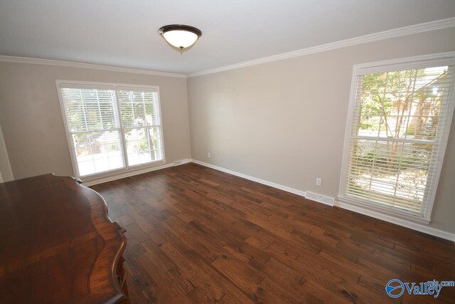 unfurnished room with crown molding and dark hardwood / wood-style flooring