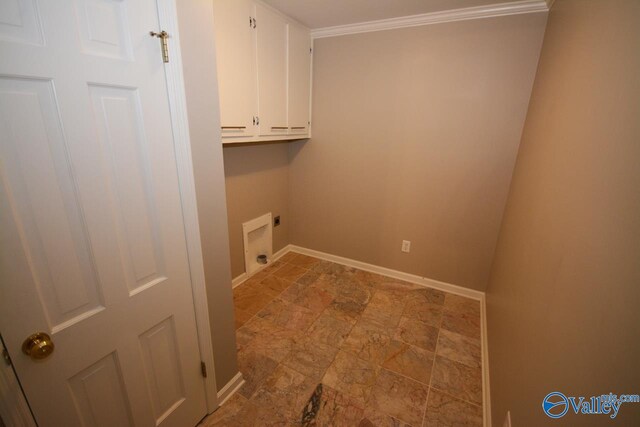 washroom with hookup for an electric dryer, cabinets, and ornamental molding