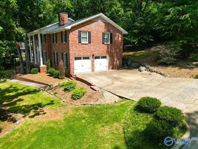 view of property exterior with a yard and a garage