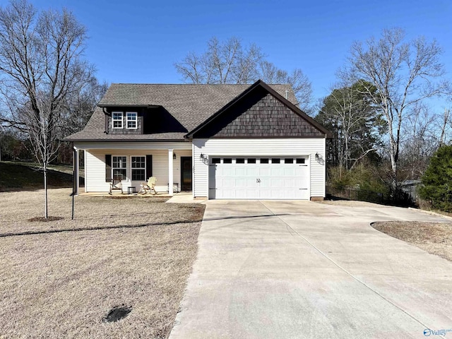 view of front of home with a garage, a porch, concrete driveway, and a shingled roof