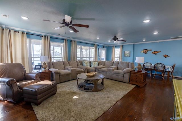 living room with ceiling fan, dark hardwood / wood-style floors, a wealth of natural light, and ornamental molding