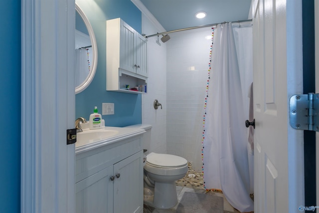 bathroom featuring toilet, vanity, a shower with shower curtain, and ornamental molding