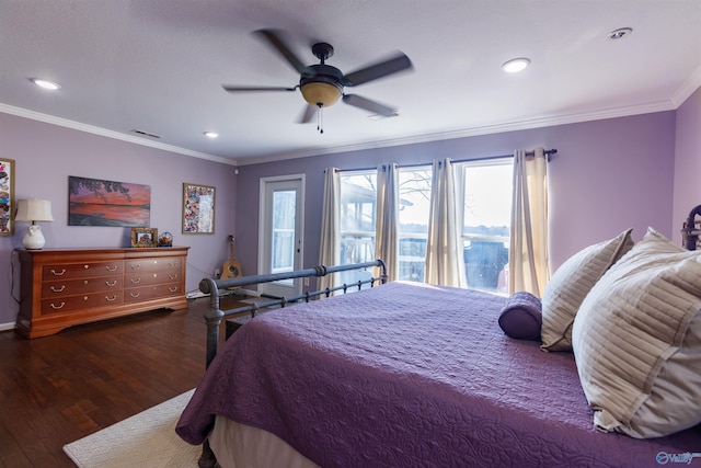 bedroom featuring ceiling fan, dark hardwood / wood-style flooring, and ornamental molding