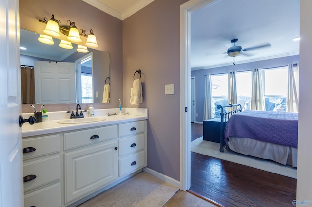 bathroom featuring vanity, plenty of natural light, and crown molding