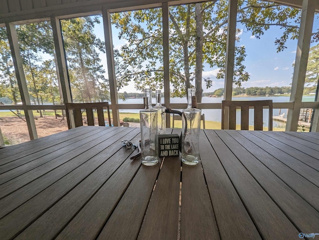 wooden deck featuring a water view