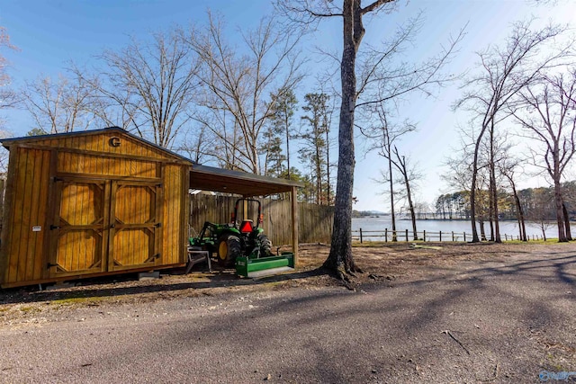 view of outbuilding featuring a water view