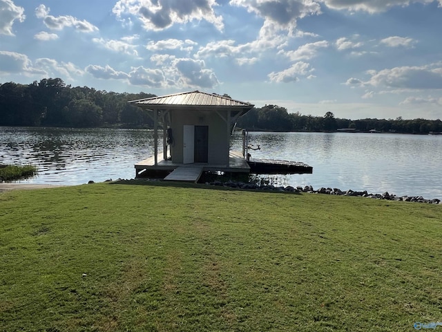 view of dock featuring a yard and a water view