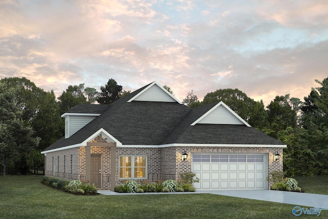 view of front of property featuring a garage and a lawn