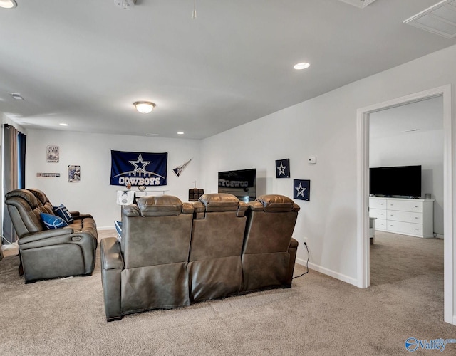 living area with carpet floors, recessed lighting, visible vents, and baseboards