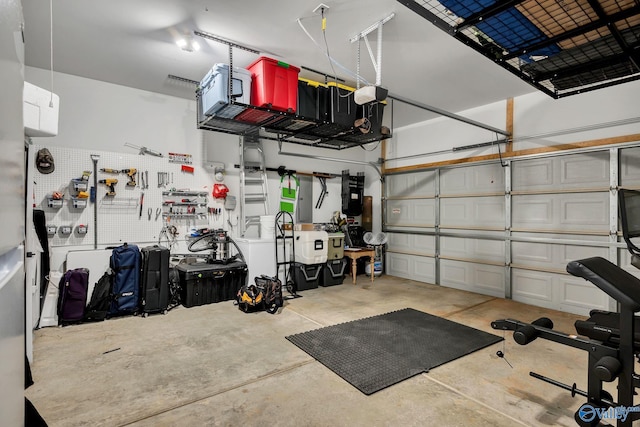 garage with a workshop area