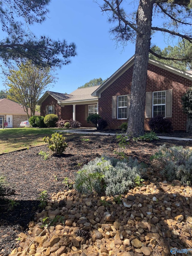 single story home with brick siding