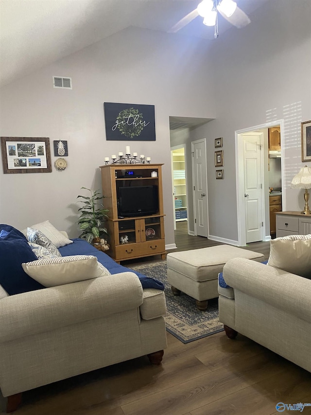 living area with wood finished floors, high vaulted ceiling, a ceiling fan, and visible vents