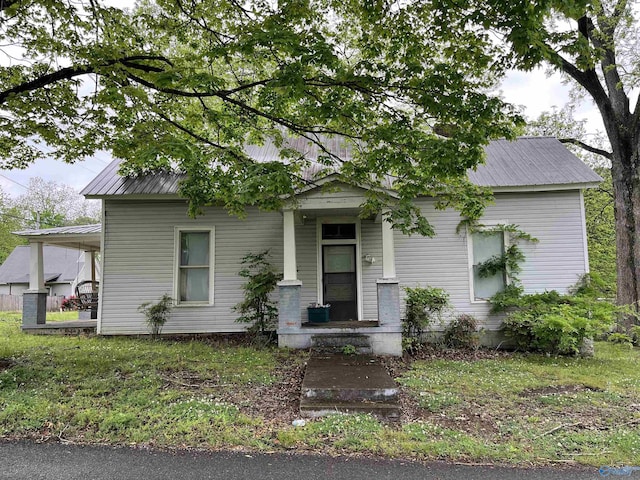 view of front of property with metal roof and a porch