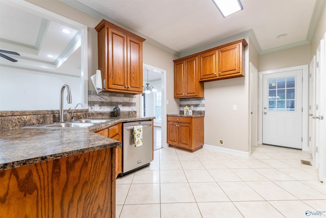 2115 James Dr, Southside, AL 35907 - kitchen featuring stainless steel dishwasher, a sink, brown cabinets, decorative backsplash, and crown molding