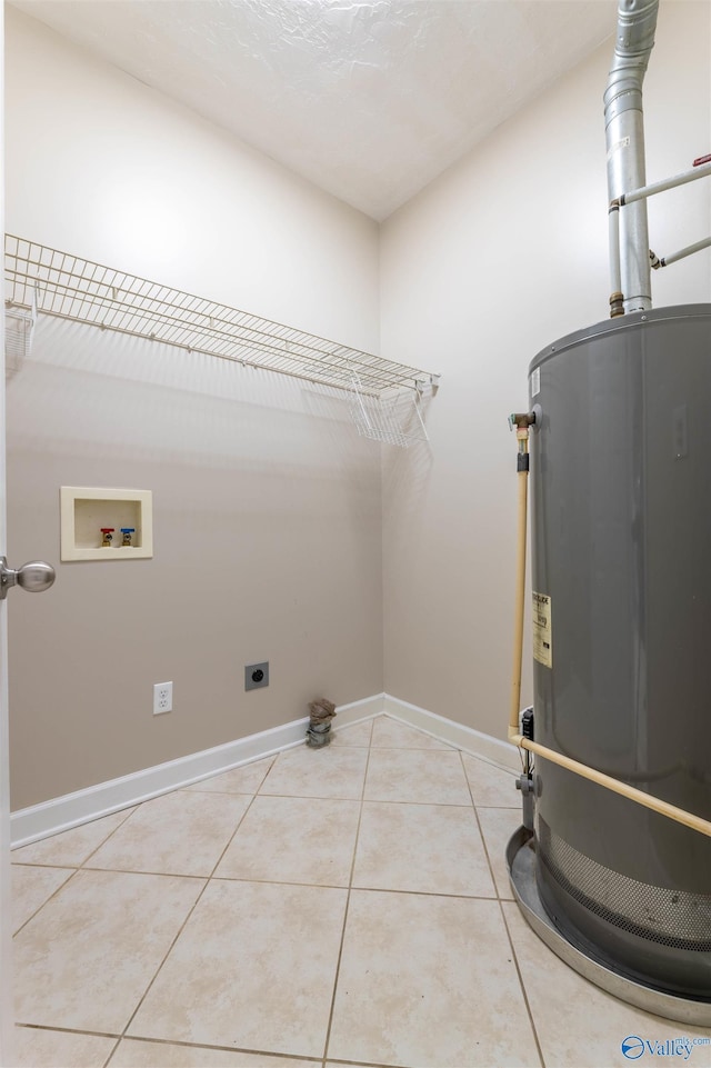 2115 James Dr, Southside, AL 35907 - washroom with hookup for a washing machine, water heater, light tile patterned floors, baseboards, and electric dryer hookup