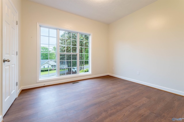 2115 James Dr, Southside, AL 35907 - empty room featuring dark wood-style flooring and baseboards