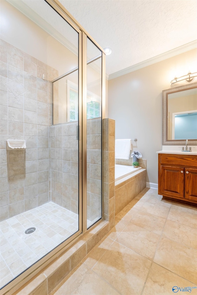 2115 James Dr, Southside, AL 35907 - full bath with ornamental molding, a stall shower, a garden tub, vanity, and tile patterned floors