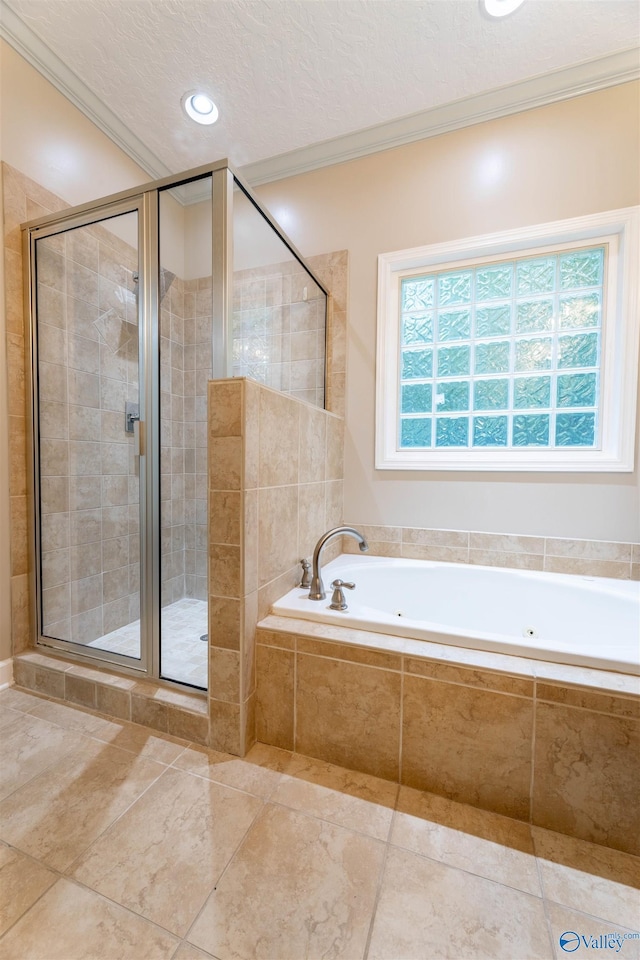 2115 James Dr, Southside, AL 35907 - bathroom featuring crown molding, a stall shower, a bath, tile patterned floors, and a textured ceiling