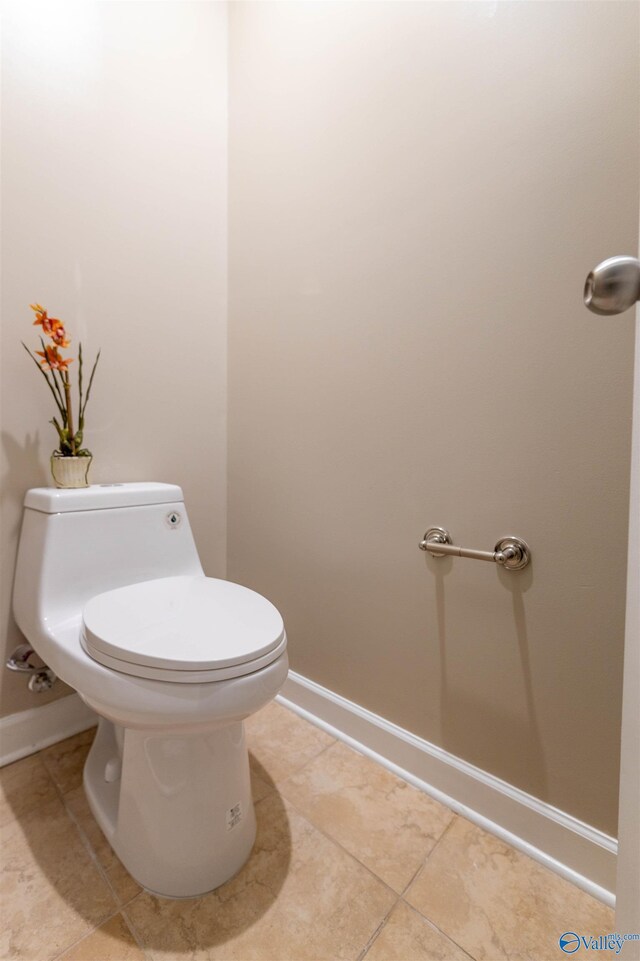 2115 James Dr, Southside, AL 35907 - bathroom featuring tile patterned flooring, baseboards, and toilet