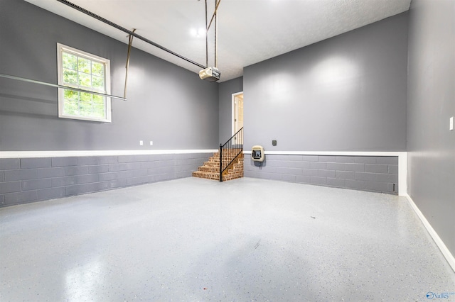 2115 James Dr, Southside, AL 35907 - empty room featuring speckle patterned floor and concrete block wall