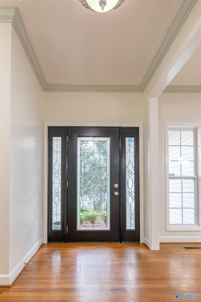 2115 James Dr, Southside, AL 35907 - entryway with wood finished floors, baseboards, and ornamental molding