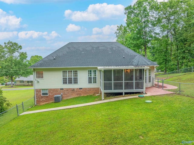 2115 James Dr, Southside, AL 35907 - rear view of house with central AC, a sunroom, a shingled roof, and a patio