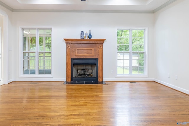 2115 James Dr, Southside, AL 35907 - unfurnished living room featuring ornamental molding, wood finished floors, a fireplace with flush hearth, and baseboards