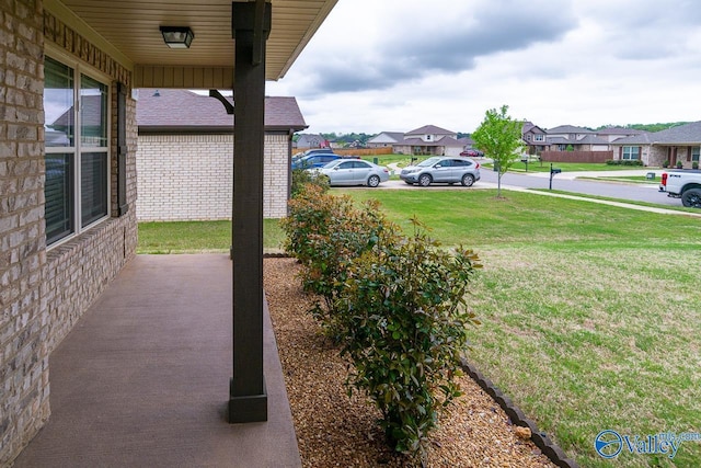 view of yard with a residential view