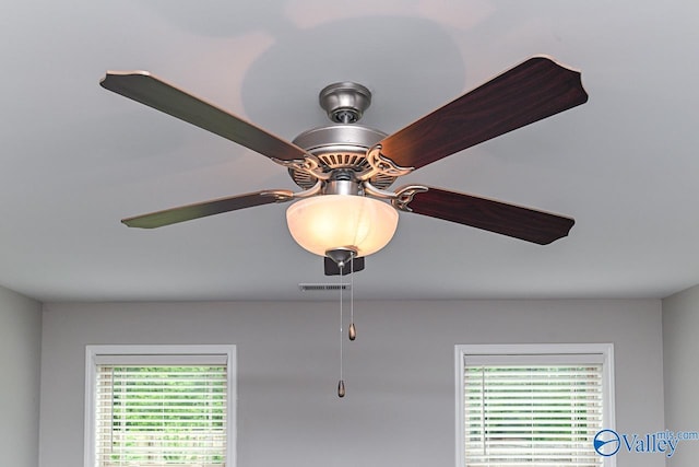 room details featuring ceiling fan and visible vents