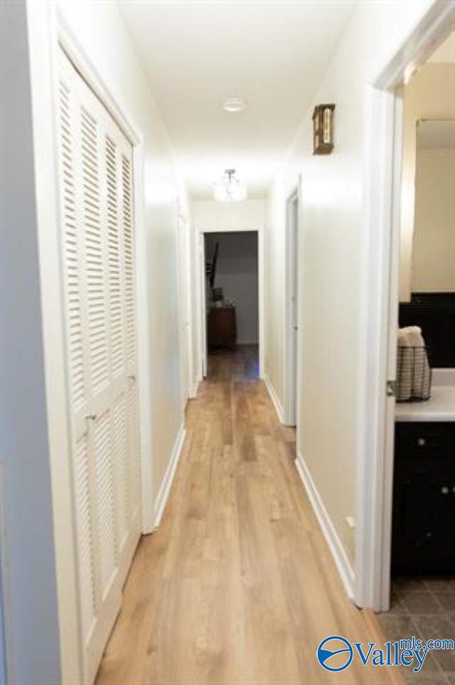 corridor featuring light hardwood / wood-style floors