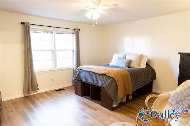 bedroom featuring ceiling fan and light wood-type flooring