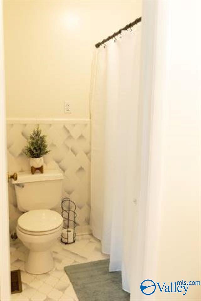 bathroom featuring toilet