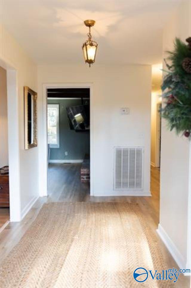 spare room with hardwood / wood-style flooring