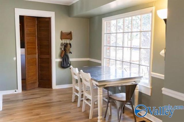 dining space with light wood-type flooring