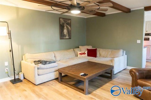 living room with beamed ceiling, ceiling fan, and hardwood / wood-style floors