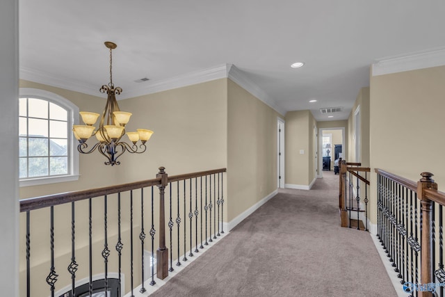 hallway with carpet floors, a chandelier, and ornamental molding