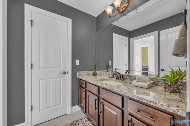 bathroom with tile patterned flooring and vanity