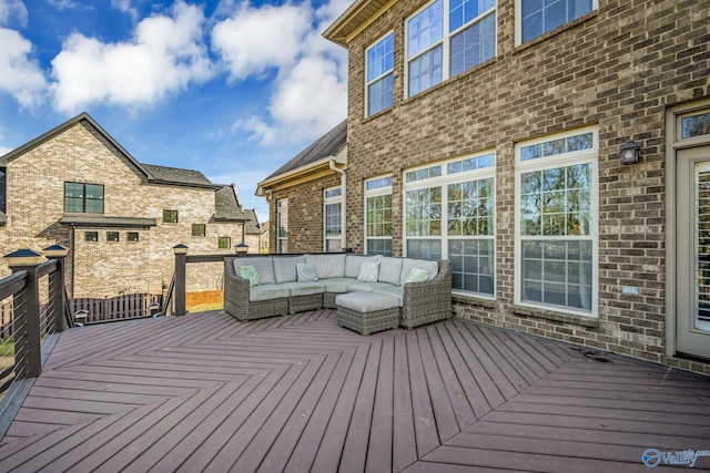 wooden terrace with an outdoor hangout area