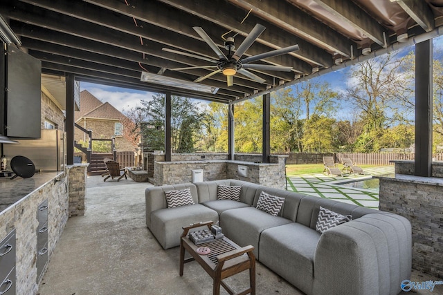 view of patio featuring outdoor lounge area and ceiling fan