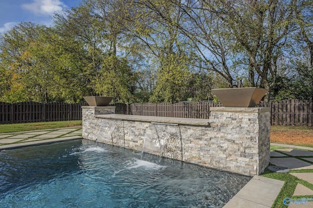 view of pool featuring pool water feature