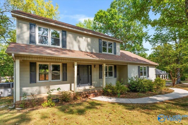 view of front of home featuring a front yard and a porch