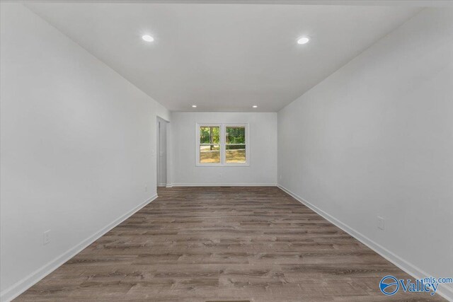 spare room featuring light hardwood / wood-style flooring