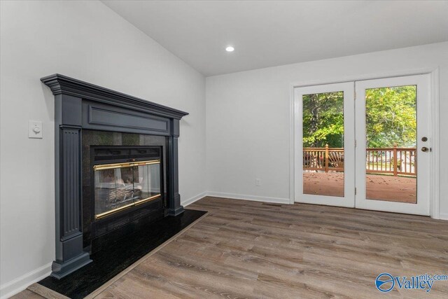 unfurnished living room featuring dark hardwood / wood-style floors