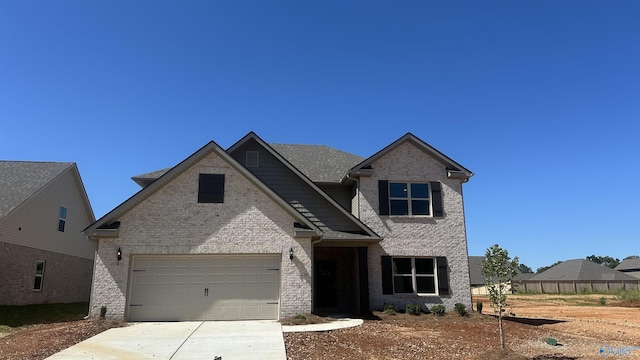 160 Saddle St, New Market, AL 35761 - view of front facade with driveway, an attached garage, and brick siding