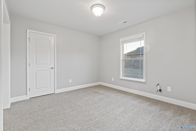 spare room with carpet floors