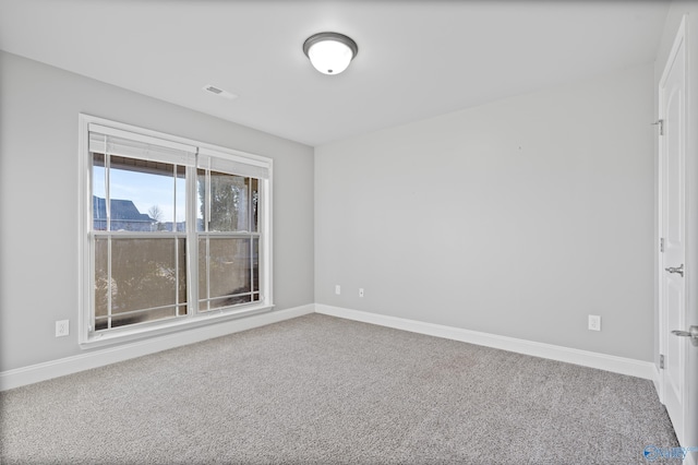 unfurnished room featuring carpet