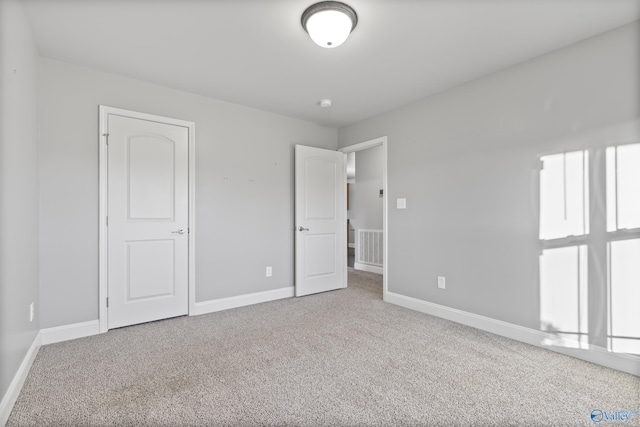 unfurnished bedroom featuring carpet floors