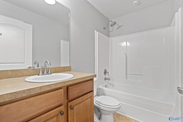 full bathroom with tile patterned flooring, vanity, shower / tub combination, and toilet