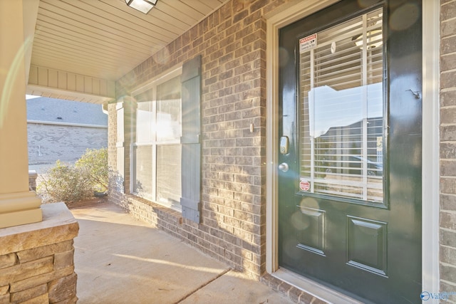 doorway to property with a porch